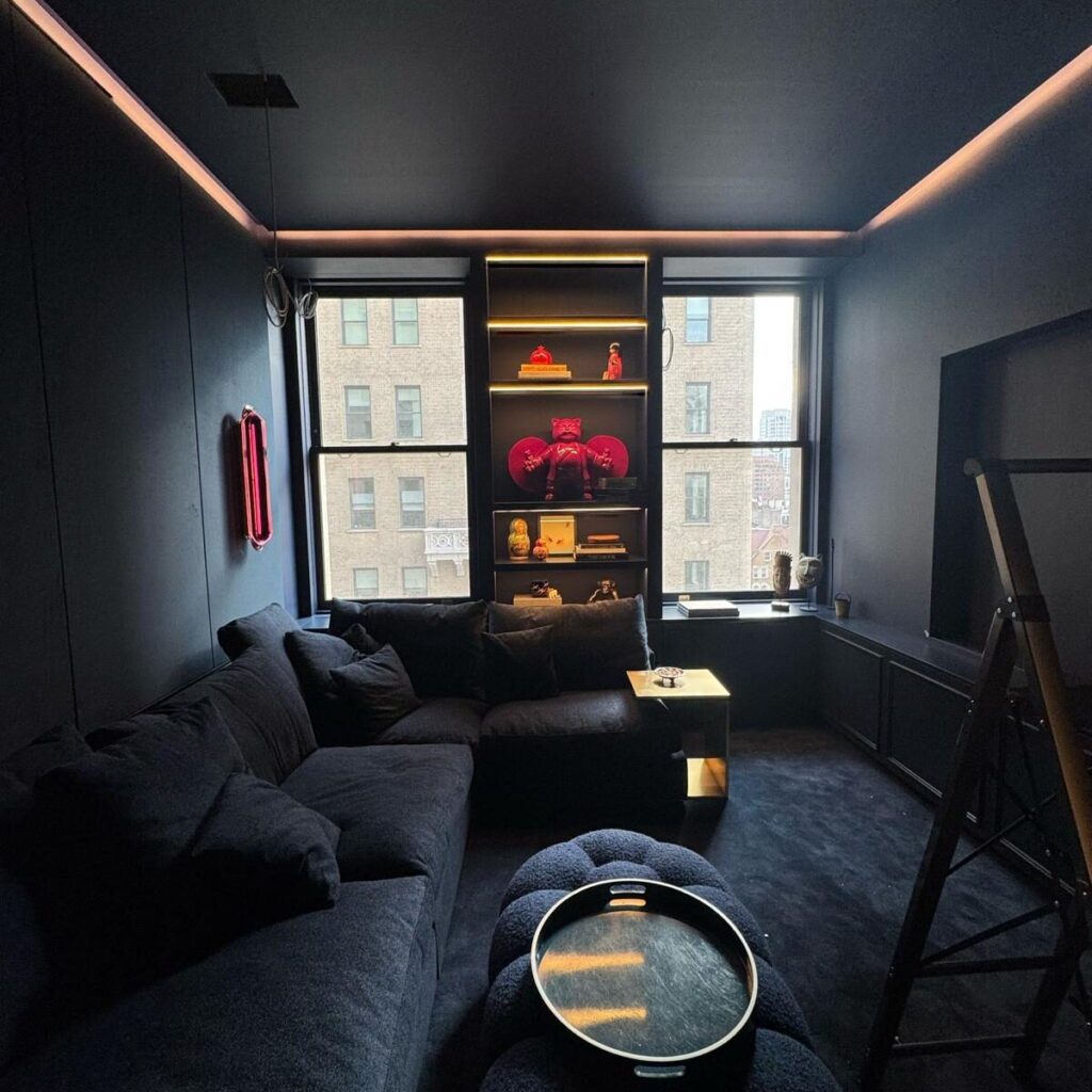 custom millwork navy blue media room shelving and cabinetry