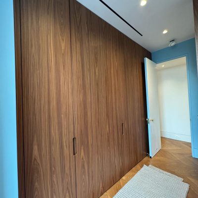 seamless built-in custom closet for kids with flush wall millwork